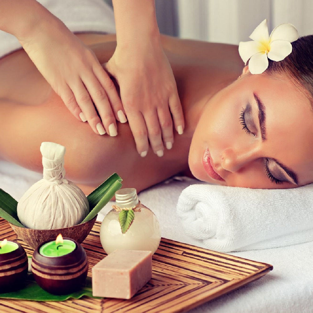 Body care. Spa body massage treatment. Woman having massage in t